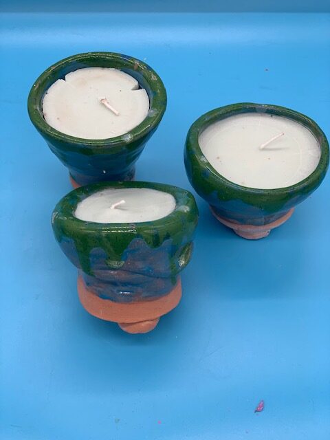 Hand thrown pots with a vanilla candle scent